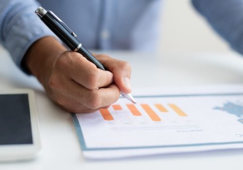 closeup-of-business-man-studying-diagram