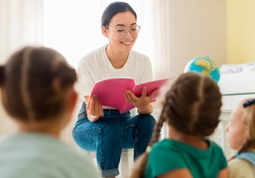 front-view-woman-reading-something-for-her-students