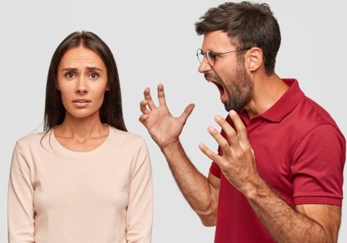 furious-bearded-guy-screams-and-gestures-angrily-yells-at-woman-have-dispute-pose-together