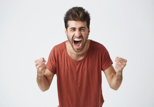 happy-positive-excited-young-man-clenching-fists-and-screaming-wearing-casual-t-shirt-glad-to-hear-good-news-celebrating-his-victory-or-success-life-achievement-goals-and-happiness-concept